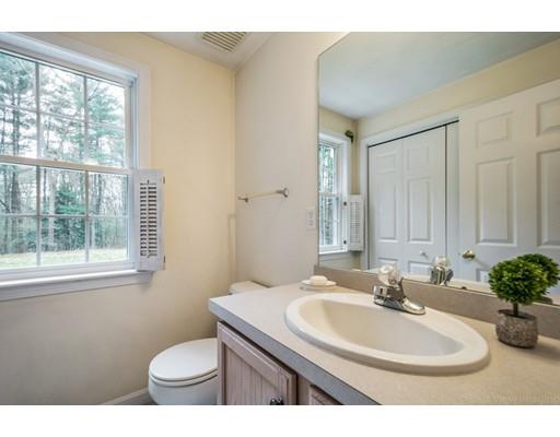 79 Rigby Road Lancaster, MA 01523 - Photo 11 of 23 a bathroom with a sink toilet and a mirror