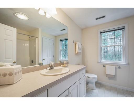 79 Rigby Road Lancaster, MA 01523 - Photo 14 of 23 a bathroom with a sink a toilet and a mirror
