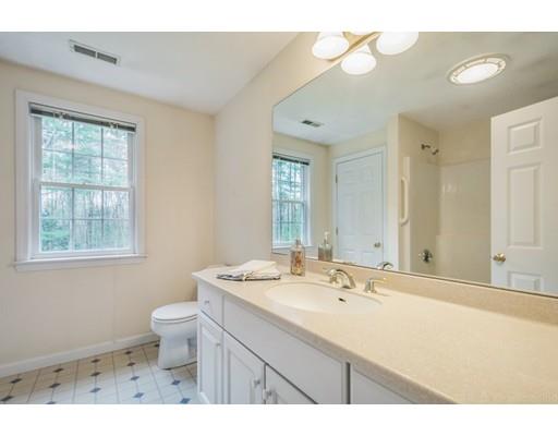 79 Rigby Road Lancaster, MA 01523 - Photo 16 of 23 a bathroom with a sink a toilet and a mirror