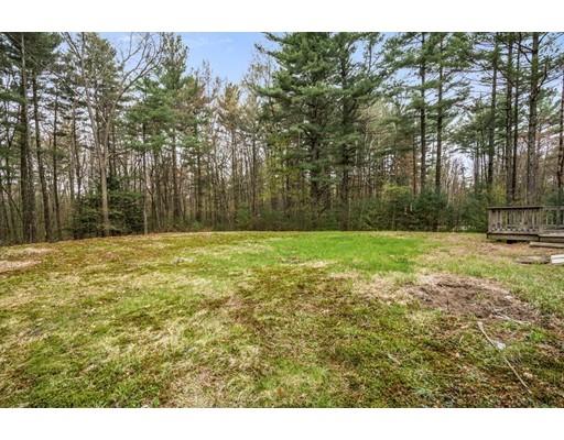 79 Rigby Road Lancaster, MA 01523 - Photo 19 of 23 a backyard of a house with lots of green space