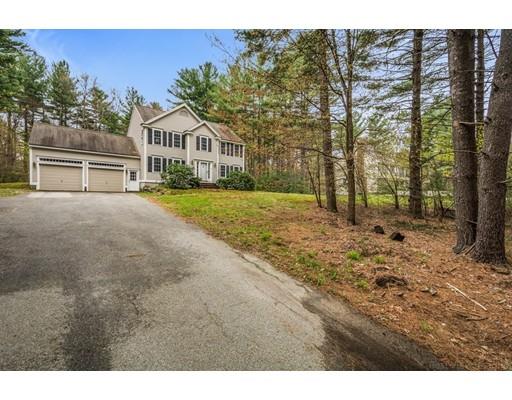 79 Rigby Road Lancaster, MA 01523 - Photo 20 of 23 a front view of a house with a yard