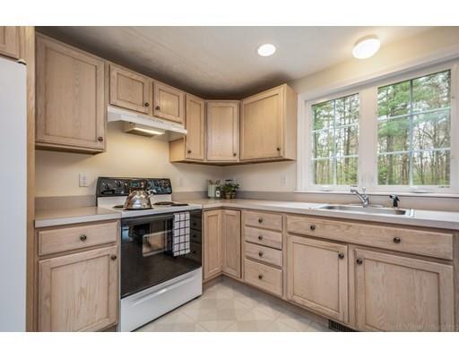 79 Rigby Road Lancaster, MA 01523 - Photo 3 of 23 a kitchen with stainless steel appliances granite countertop a stove a sink and white cabinets