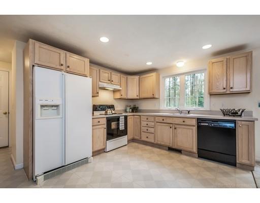 79 Rigby Road Lancaster, MA 01523 - Photo 4 of 23 a kitchen with granite countertop a refrigerator stove top oven and sink