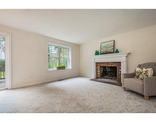 79 Rigby Road Lancaster, MA 01523 - Photo 8 of 23 a living room with furniture and a fireplace