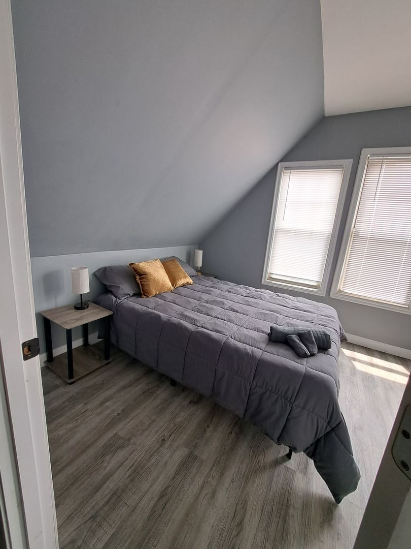 3128 North Clybourn Avenue, Unit 2R Chicago, IL 60618 - Photo 24 of 33 a bedroom with a bed and a window