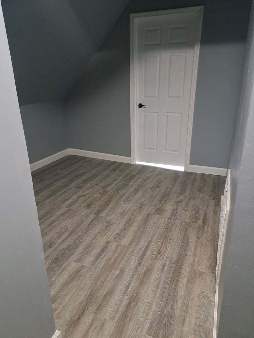 3128 North Clybourn Avenue, Unit 2R Chicago, IL 60618 - Photo 25 of 33 a view of an empty room with wooden floor