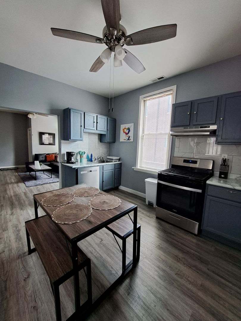 3128 North Clybourn Avenue, Unit 2R Chicago, IL 60618 - Photo 4 of 33 a kitchen with a stove and a refrigerator
