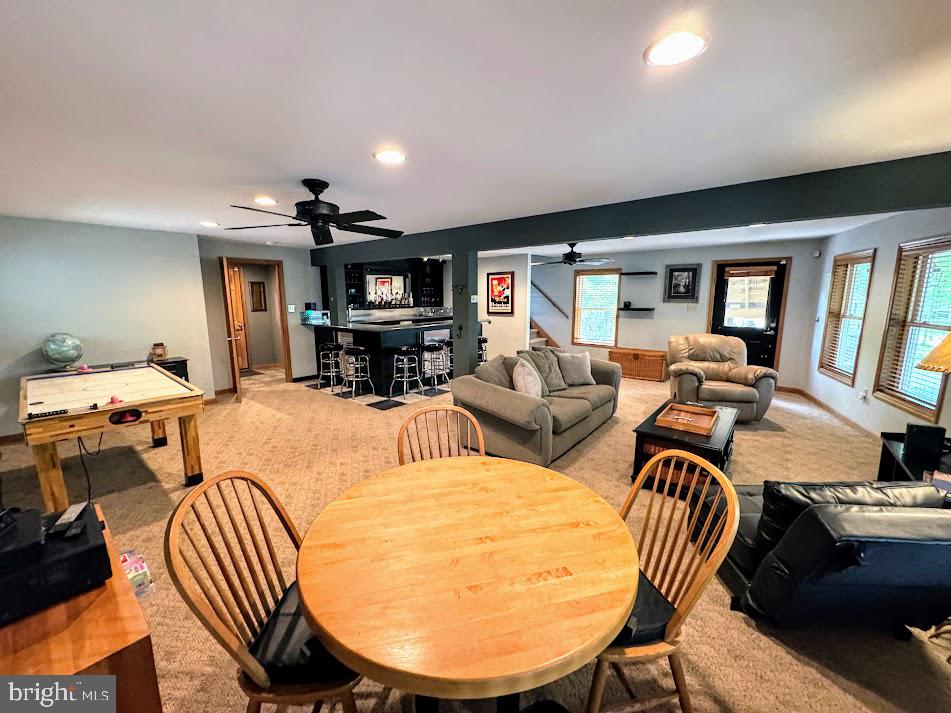 64 Algonquin Drive Hazleton, PA 18202 - Photo 18 of 64 a living room with furniture a fireplace and large windows