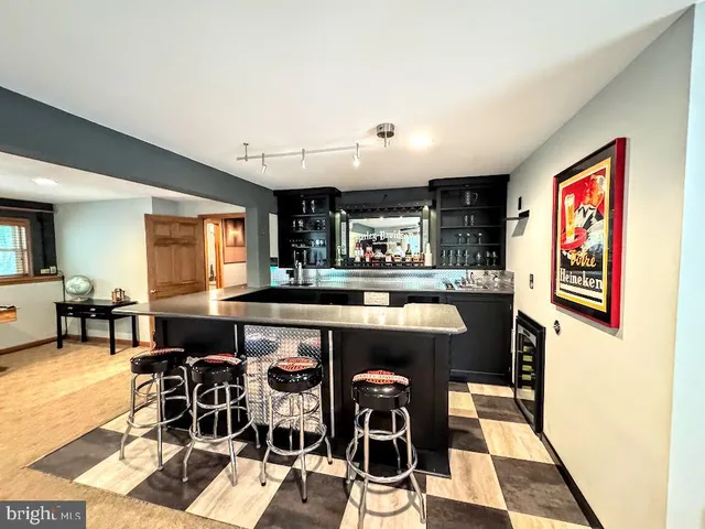 a bedroom with a large bed and a large window