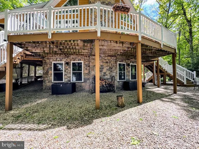 a view of a house with a porch and furniture