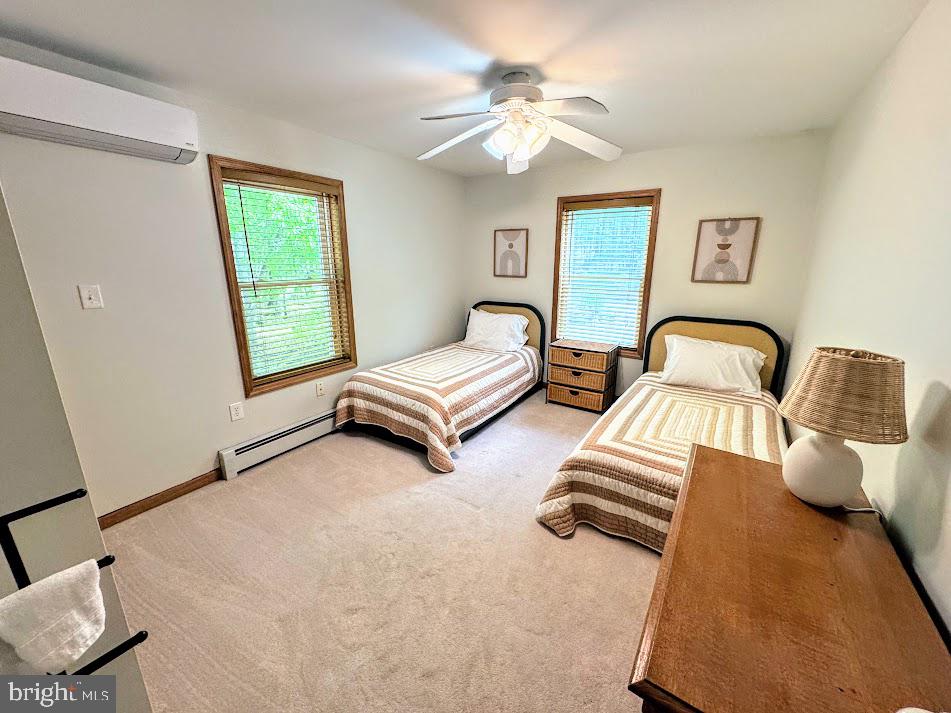 64 Algonquin Drive Hazleton, PA 18202 - Photo 30 of 64 a bedroom with two beds and a window