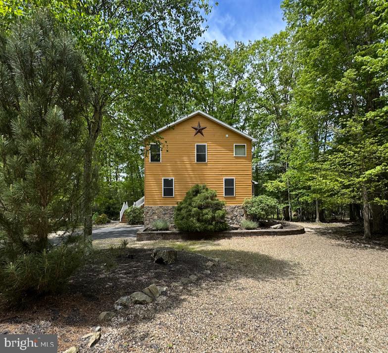 64 Algonquin Drive Hazleton, PA 18202 - Photo 3 of 64 a view of a house with a yard and large trees