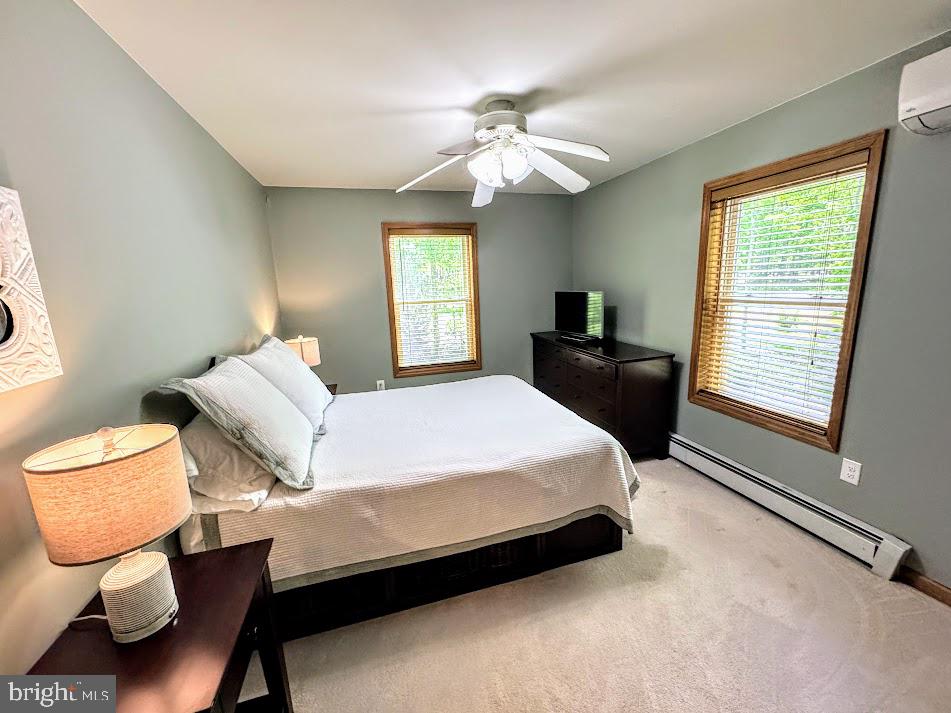 64 Algonquin Drive Hazleton, PA 18202 - Photo 32 of 64 a bedroom with a bed and a chandelier