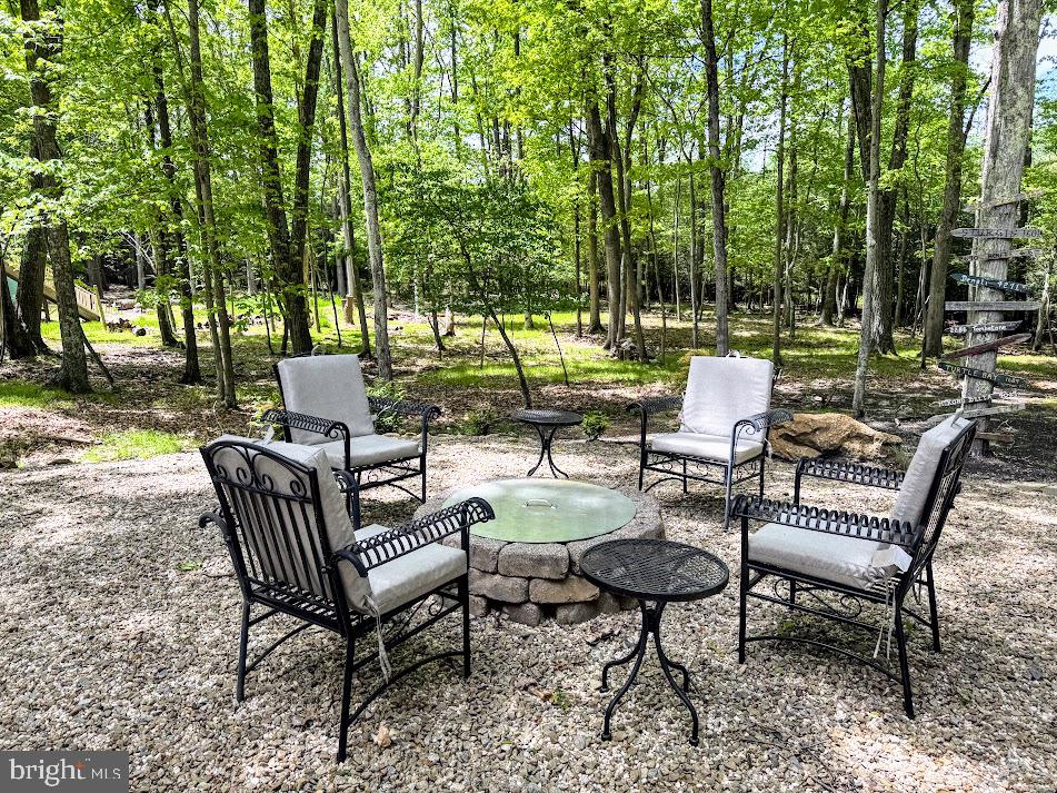 64 Algonquin Drive Hazleton, PA 18202 - Photo 4 of 64 a view of a chairs and table in backyard of a house