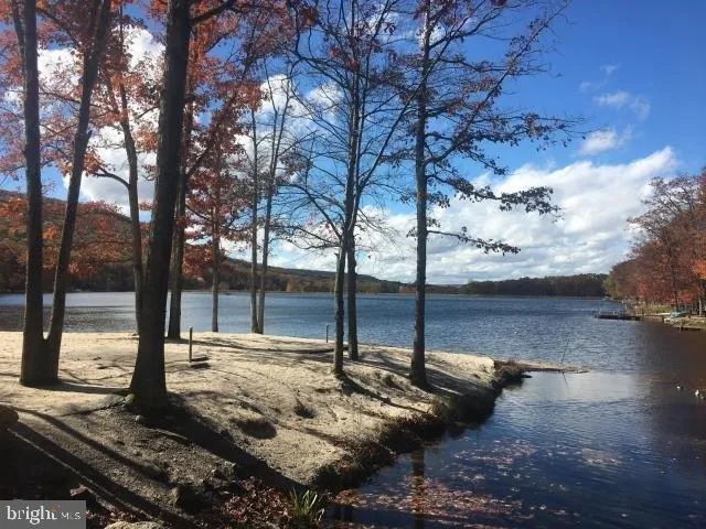 a view of swimming pool with an outdoor space and seating area