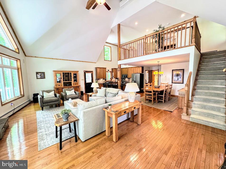 64 Algonquin Drive Hazleton, PA 18202 - Photo 8 of 64 a living room with fireplace furniture and a wooden floor