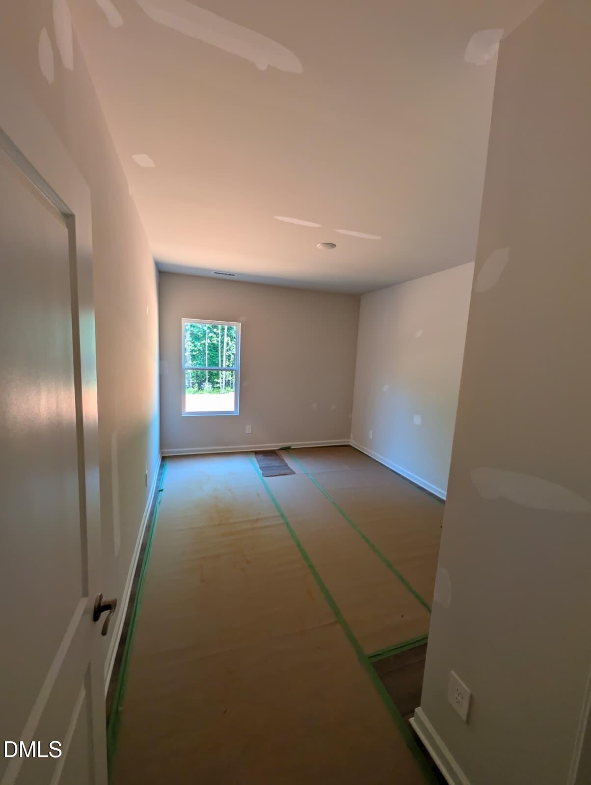 308 Karlov Road Garner, NC 27529 - Photo 11 of 55 a view of an empty room and window