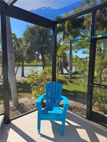 a wooden bench sitting in front of a building