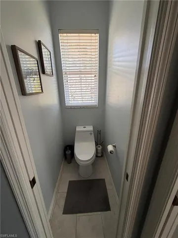 a bathroom with a toilet and a sink