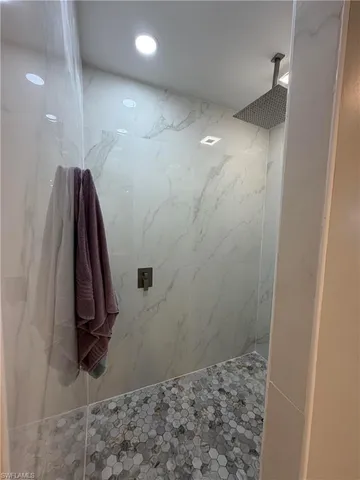 a bathroom with a bathtub and shower