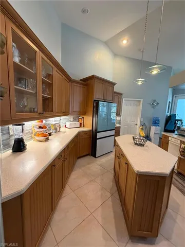 a stove top oven sitting inside of a kitchen