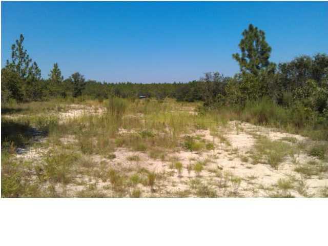 80-ac Ranch Road DeFuniak Springs, FL 32433 - Photo 9 of 13 a view of lake with sunset