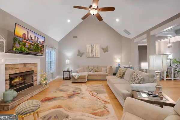 a living room with furniture and a fireplace
