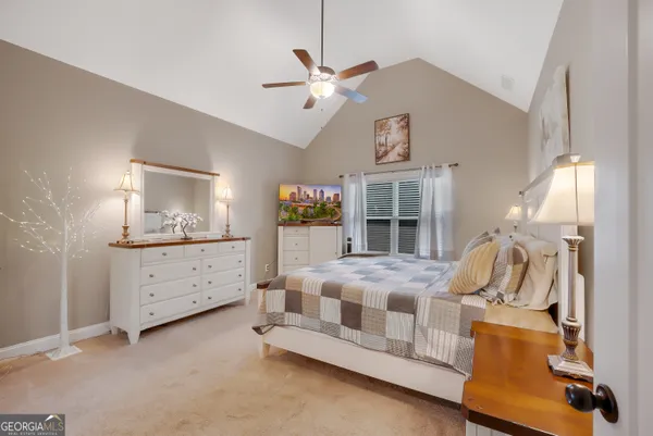 a bed room with a bed and a chandelier