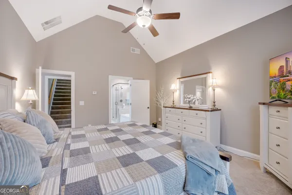 a bedroom with a bed and a dresser