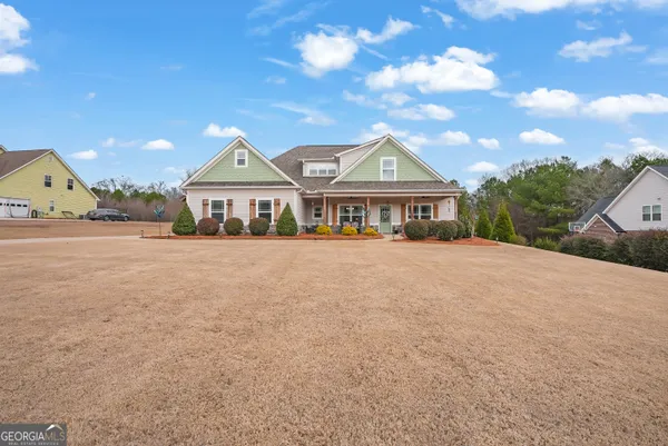 a front view of a house with a yard