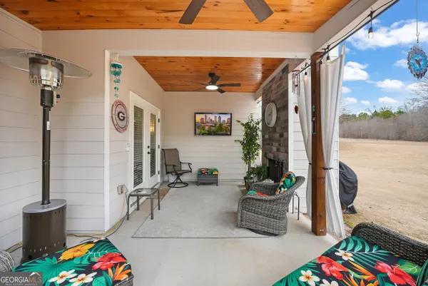 a room with musical instrument pool table and windows
