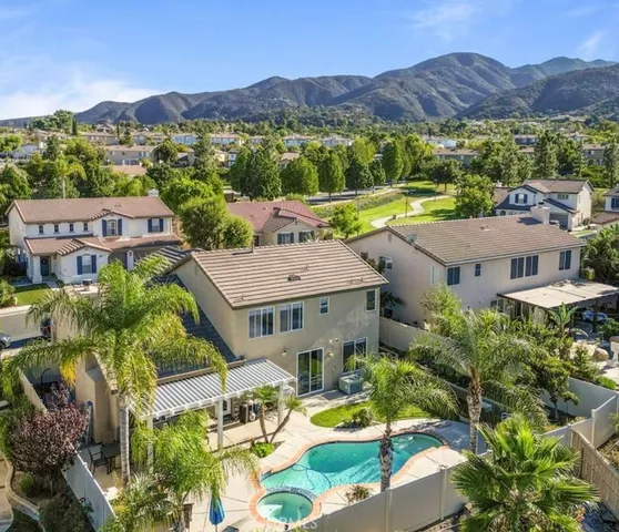an aerial view of residential houses and outdoor space