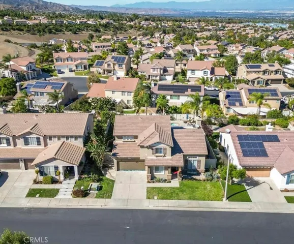 an aerial view of residential houses with outdoor space