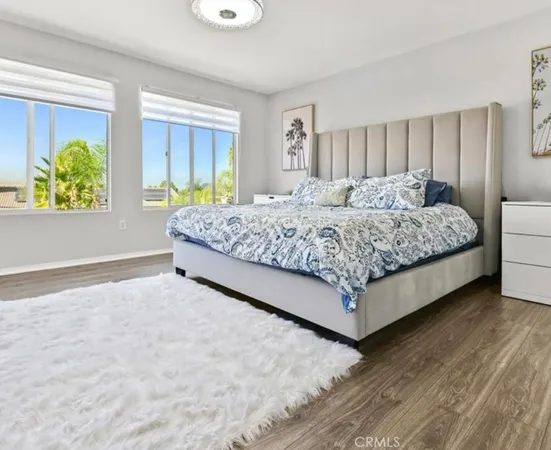 a living room with a bed and a window