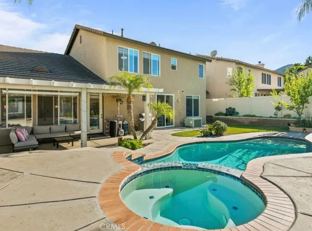 a view of a house with swimming pool and porch
