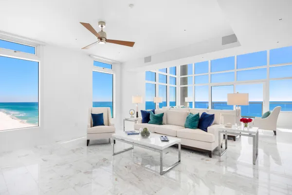 a living room with furniture and a rug