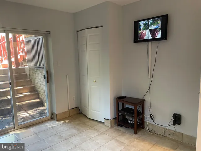 a view of a livingroom with furniture and a window
