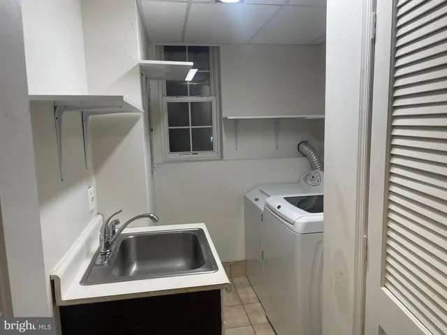 a bathroom with a sink and toilet