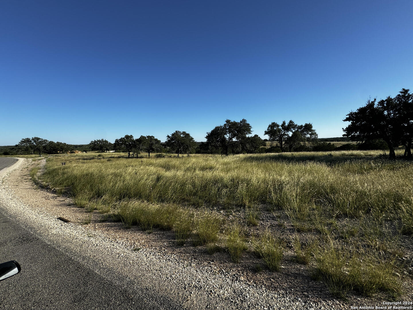 Lot 89 Loma Vista Ranch Phase 4 Kerrville, TX 78028 - Photo 1 of 9 a view of a lake with houses in the background