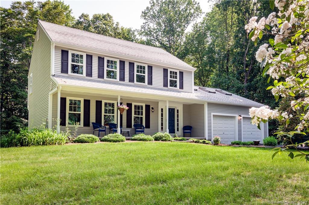 71 Winterhill Road Madison, CT 06443 - Photo 1 of 1 a front view of a house with a yard and trees