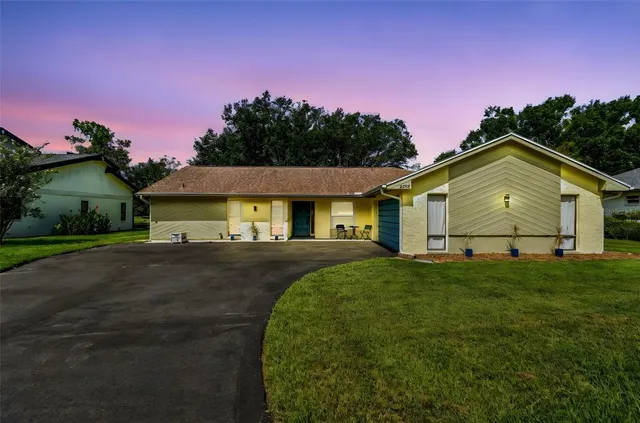 a view of a house with a big yard