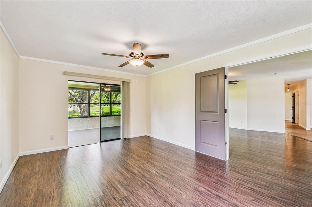 5319 Saddlebrook Way Wesley Chapel, FL 33543 - Photo 18 of 77 wooden floor in an empty room with a window
