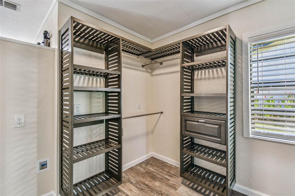 5319 Saddlebrook Way Wesley Chapel, FL 33543 - Photo 20 of 77 a view of walk in closet with clothes and shoes