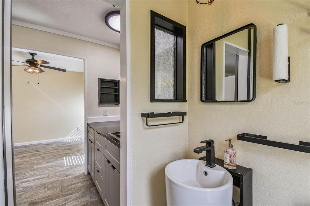 5319 Saddlebrook Way Wesley Chapel, FL 33543 - Photo 25 of 77 a bathroom with a sink and a mirror