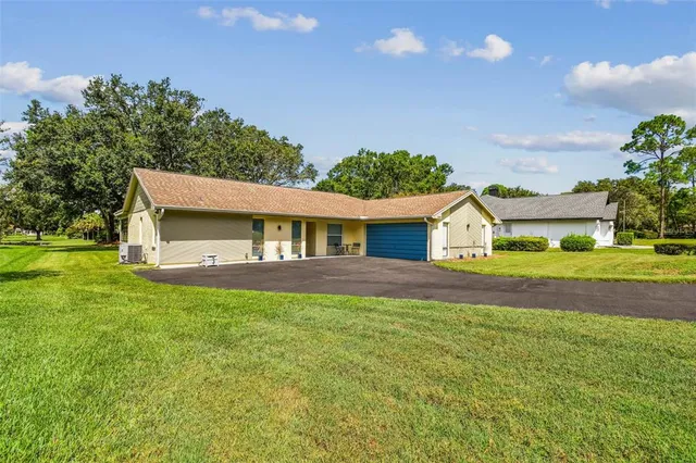a front view of a house with a garage