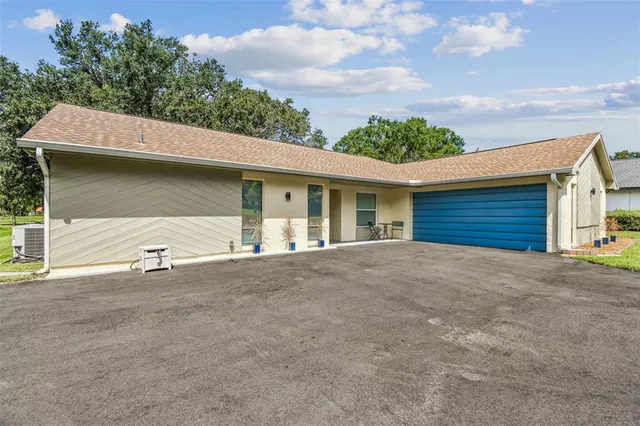 a view of an empty room with closet and wooden floor