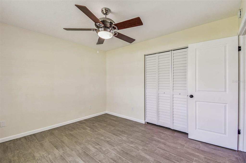 5319 Saddlebrook Way Wesley Chapel, FL 33543 - Photo 44 of 77 wooden floor in an empty room