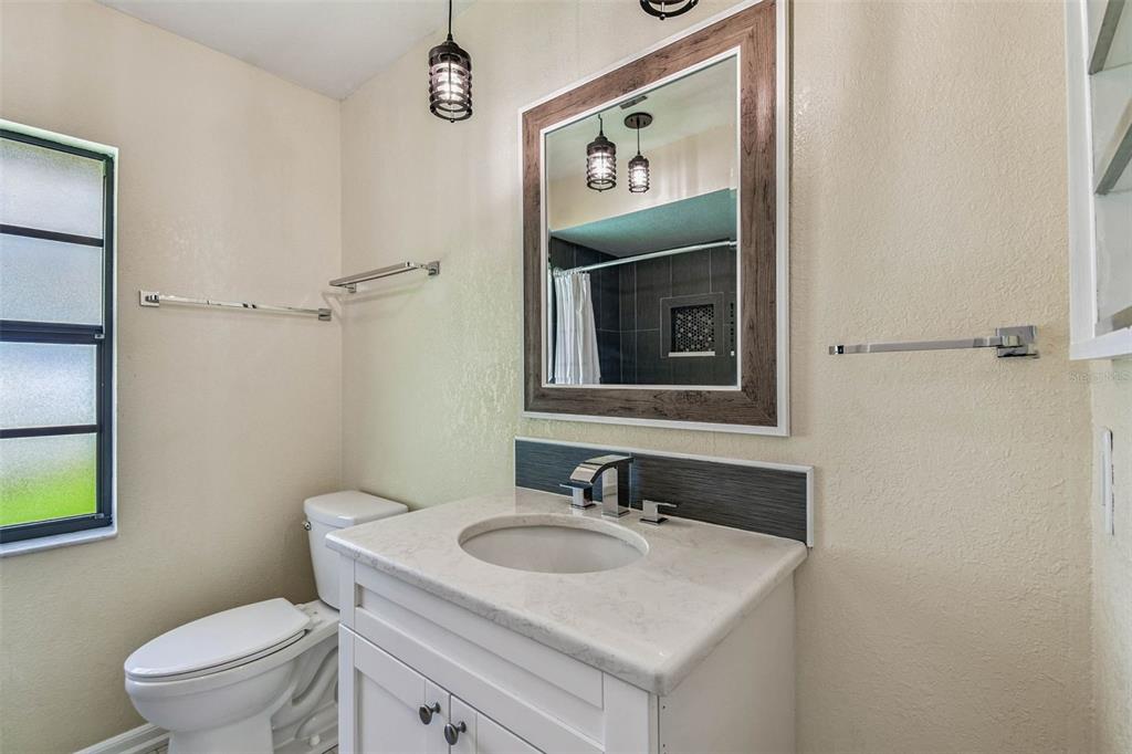 5319 Saddlebrook Way Wesley Chapel, FL 33543 - Photo 45 of 77 a bathroom with a sink toilet and mirror