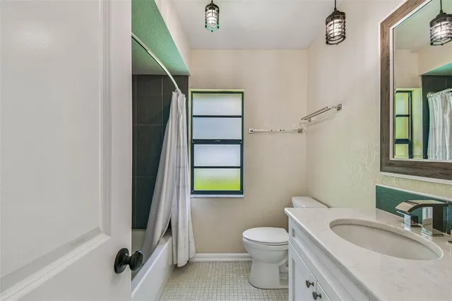 an aerial view of a house with a swimming pool yard and outdoor seating