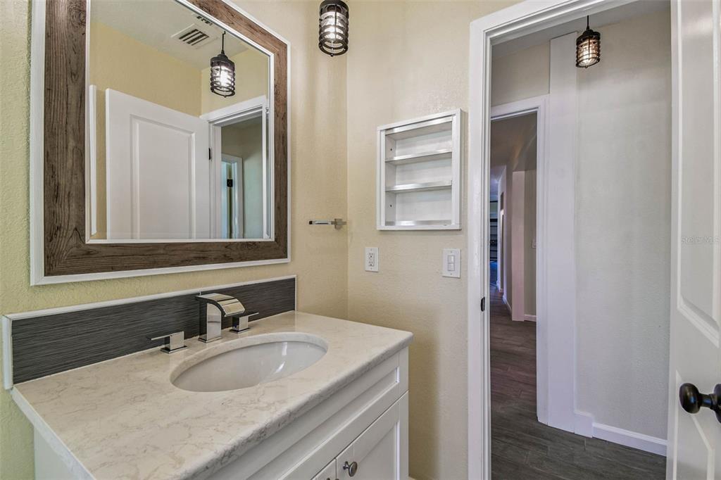 5319 Saddlebrook Way Wesley Chapel, FL 33543 - Photo 48 of 77 a bathroom with a sink and a mirror